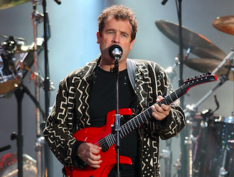 Johnny Clegg performs during the 46664 concert honouring Nelson Mandela's 90th birthday in Hyde Park, London. Credit to Times Live/Ian West/PA Images via Getty Images