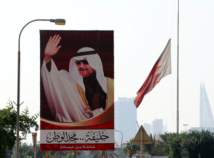 Bahraini PM Khalifa bin Salman al-Khalifa speaks to the opposition MP Sheik Hassan Sultan after the opening session of the new parliament on 21 December 2019 in Manama, Bahrain. Credit to AP/Hasan Jamali
