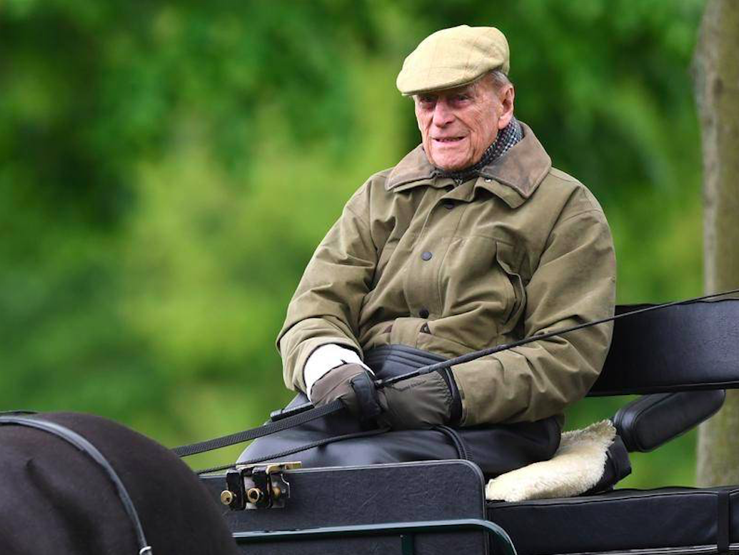 Prince Philip drives a carriage. Credit: PA