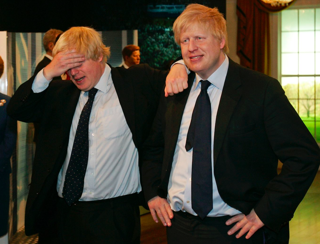 Boris Johnson (left) poses with a wax figure of himself (right) at Madame Tussauds in London, May 2009. Credit: Sang Tan/AP