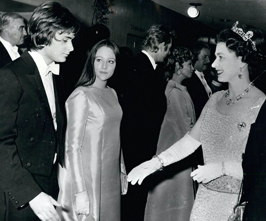 Leonard Whiting and Olivia Hussey with Queen Elizabeth II during the Royal Film Performance at the Odeon in Leicester Square in 1968. Credit: Daily Mail/Alamy Stock Photo
