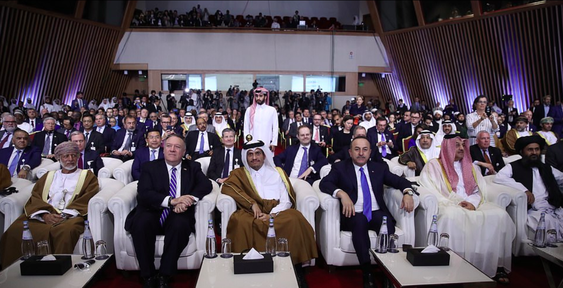 Mike Pompeo (second from left), Minister of Foreign Affairs of Qatar Mohammed bin Abdulrahman bin Jassim Al-Thani (C), Turkish Foreign Minister Mevlut Cavusoglu (centre right), and Mullah Baradar (R). Credit to Getty Images