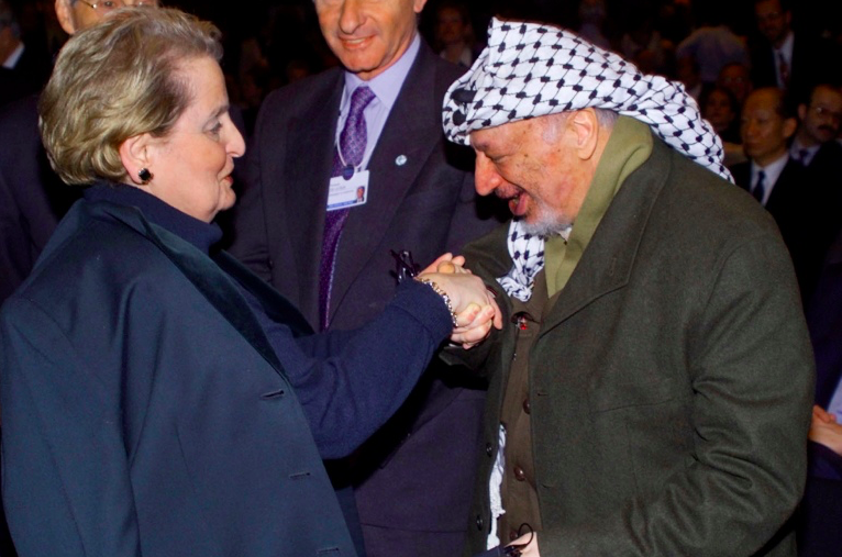 Palestinian President Yasser Arafat greets US Secretary of State Madeleine Albright at the World Economic Forum in Davos, Switzerland, on 29 Jan 2000. Credit to Joe Marquette/AP