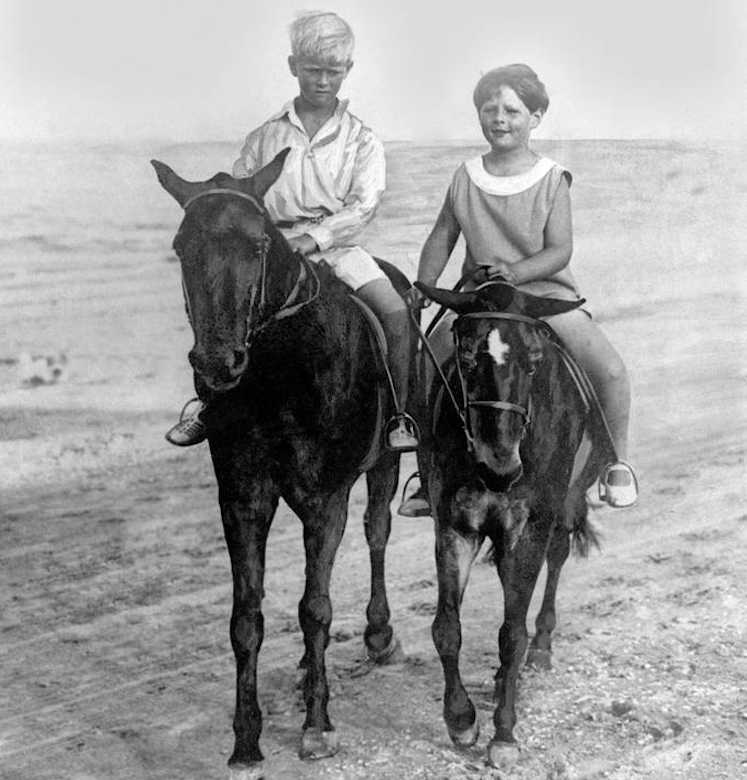 Prince Philip of Greece (left) rides with his cousin, King Michael of Romania on the sands at Constanza in 1928. Credit: iTV Report/PA