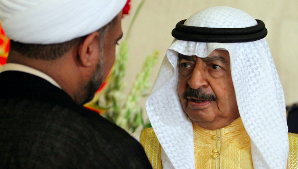 Bahraini PM Khalifa bin Salman al-Khalifa speaks to the opposition MP Sheik Hassan Sultan after the opening session of the new parliament on 21 December 2019 in Manama, Bahrain. Credit to AP/Hasan Jamali