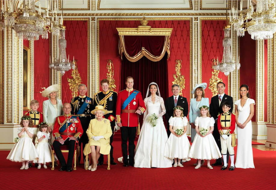 Prince William and Catherine, Duchess of Cambridge, pose for an official photograph with their families on the day of their wedding, in the throne room at Buckingham Palace in 2011. Credit to Hugo Burnand/Clarence House/Reuters