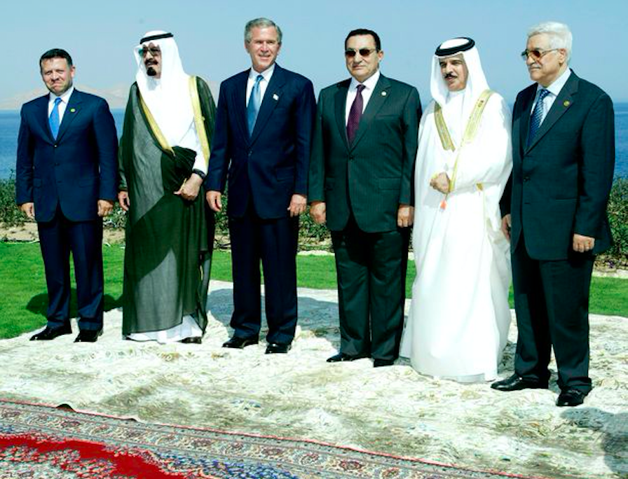 US President George W Bush (third from left) and Egyptian President Hosni Mubarak (third from right) with the middle east leaders in Sharm El-Sheikh (2003). Credit to Reuters