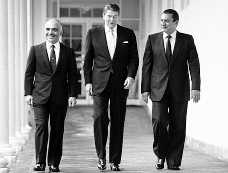 King Hussein of Jordan (L), US President Ronald Reagan (C) and President Hosni Mubarak of Egypt (R) in the White House, 14 February 1984. Credit to Barry Thumma/AP