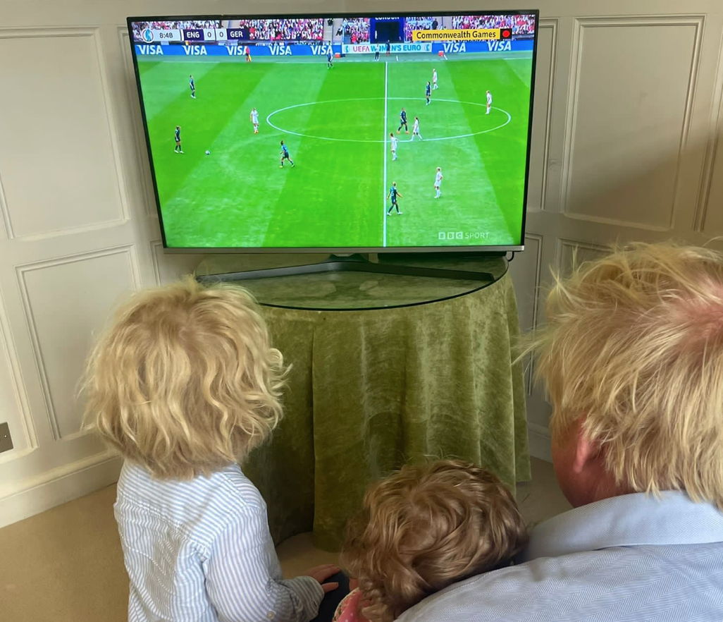 PM Boris Johnson watching the match on TV with daughter Romy and son Wilfred at 8.20 PM tonight. Credit to Boris Johnson via Twitter