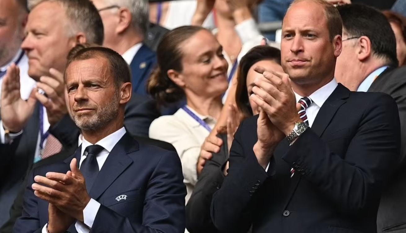 UEFA president Aleksander Ceferin (L) and Prince William (R) applaud prior to the match between England and Germany. Credit to AFP via Getty Images