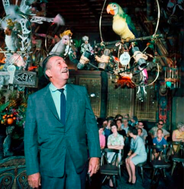 Walt Disney with a green parrot. Credit to Walt Disney Archives