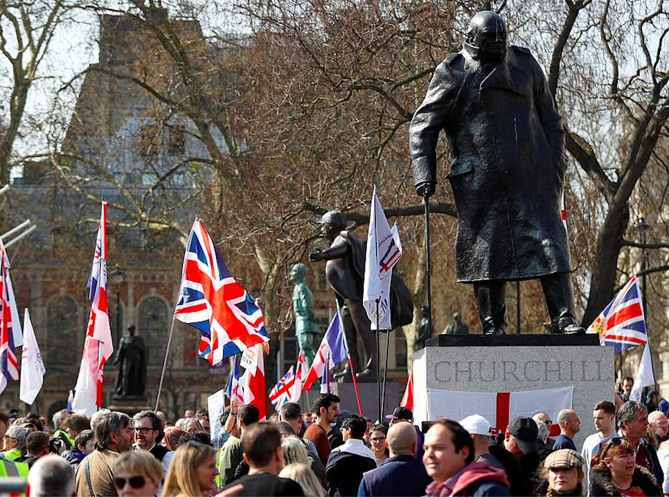 Statue of Winston Churchill witnessed hundreds of British flags outnumbering the turnout of European flags this morning. Credit: The Daily Mail/Reuters