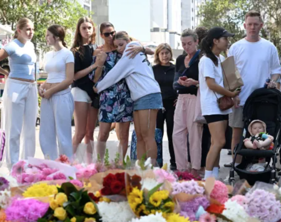 Floral tributes are laid outside Westfield Bondi Junction. Credit to Reuters