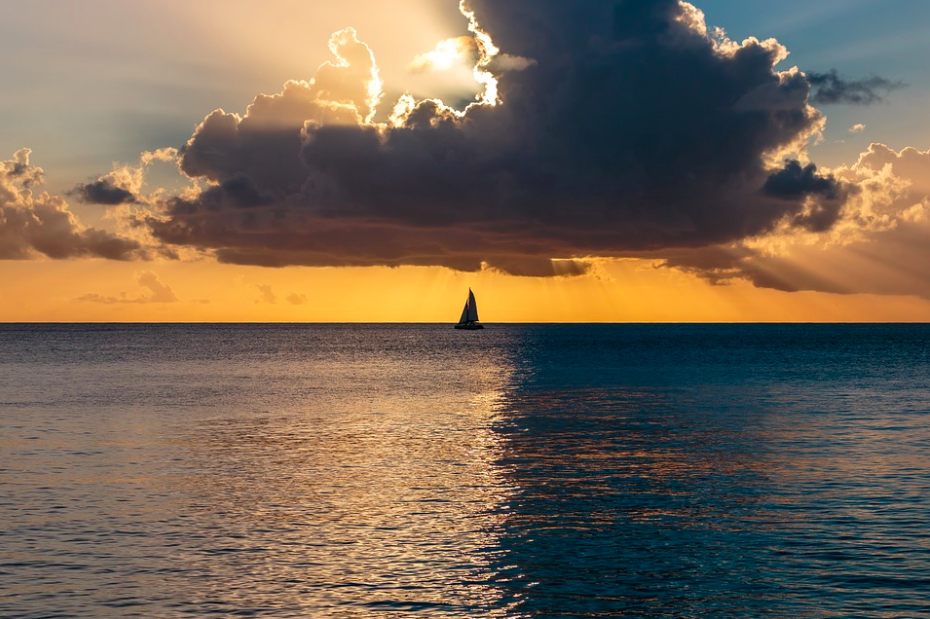 A sailboat at ocean sunset, Barbados