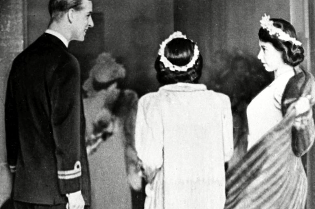 At the wedding of Patricia Mountbatten in December 1946, Philip as an usher, 20-year-old Princess Elizabeth of York (left) and her younger sister Princess Margaret Rose. Credit: Reader's Digest/AP/Shutterstock