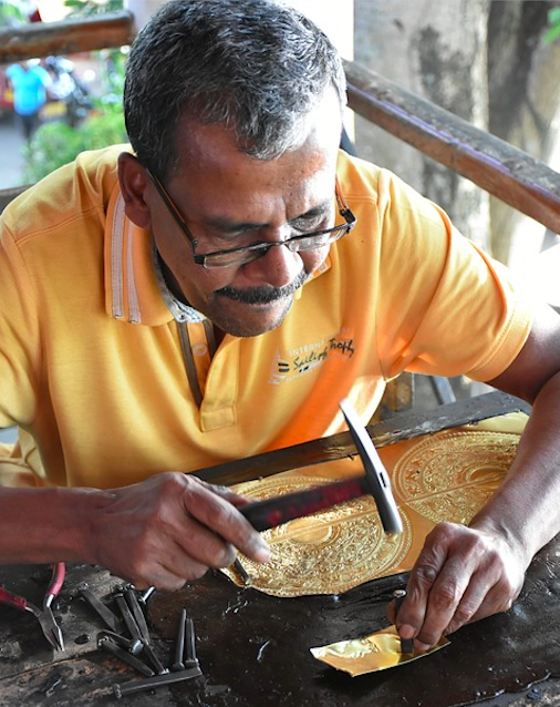 A Sri Lankan blacksmith forging copper. Credit: Zsolt Nagy
