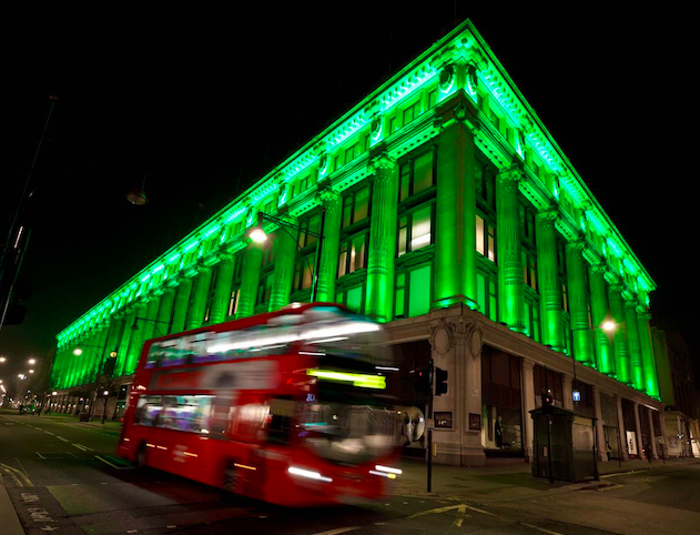 Selfridges in London lit up green. Credit: PA Archive/PA Images