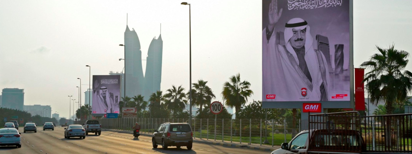 Posters of the late PM Sheikh Khalifa in the capital city of Manama on Wednesday, after the announcement of his passing. Credit to Mazen Mahdi/AFP via Getty Images
