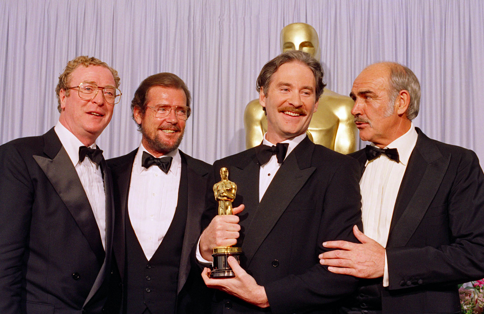 Michael Caine, Roger Moore, Kevin Kline, and Sean Connery (L-R). Credit to People magazine