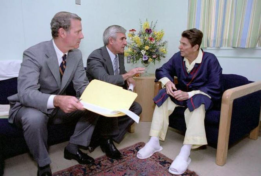 President Reagan with White House aides at the George Washington Hospital the morning after the assassination attempt on 30 March 1981. Credit to Reagan Library