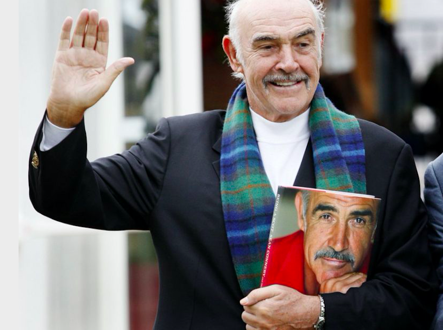 A proud Scotsman with his 2008 book Being A Scot. Credit to BBC News/AFP