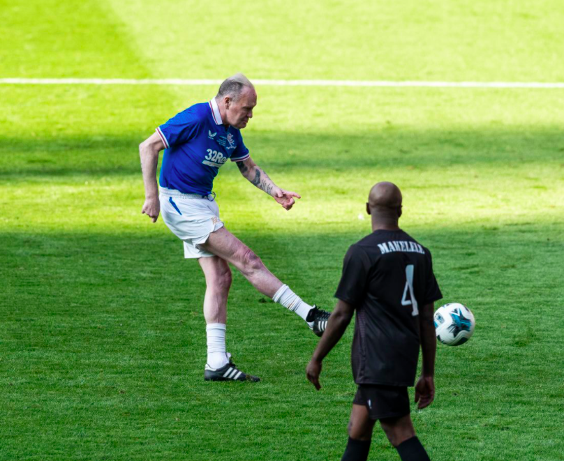 Paul Gascoigne is on the pitch. Credit to The Rangers (rangers.co.uk)