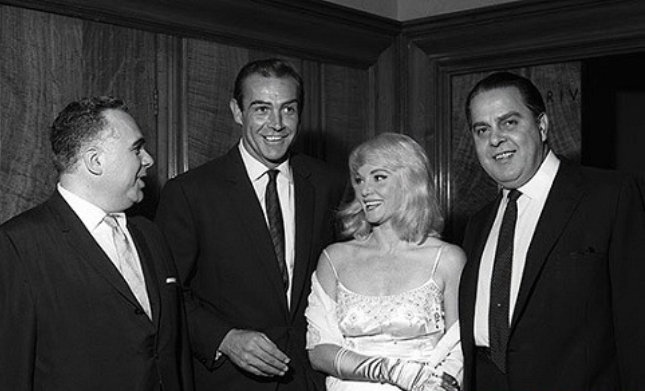 Sean Connery with his first wife Diane Cilento, Albert R. Broccoli and Harry Saltzman in 1963. Retrieved from Facebook