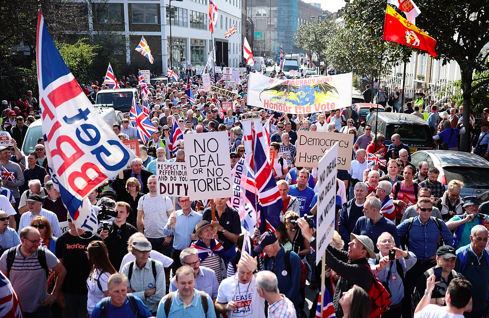Smiling but stubborn in their demand 'Democracy v Hypocrisy'. Credit: The Daily Mail/Getty Images
