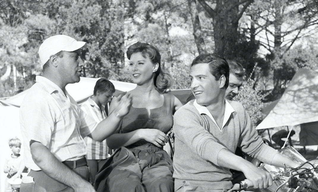 Franco Zeffirelli, Marisa Allasio, and Nino Manfredi on the set of "Camping" (Italy, 1957). Credit: Reporters Associati & Archivi/Mondadori Portfolio via Getty Images
